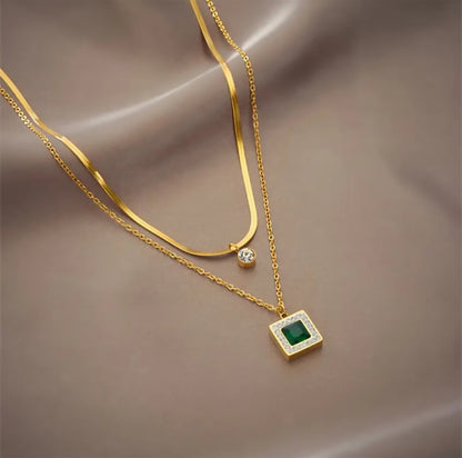 Emerald Zircon Studded Pendants Along with Golden Chains